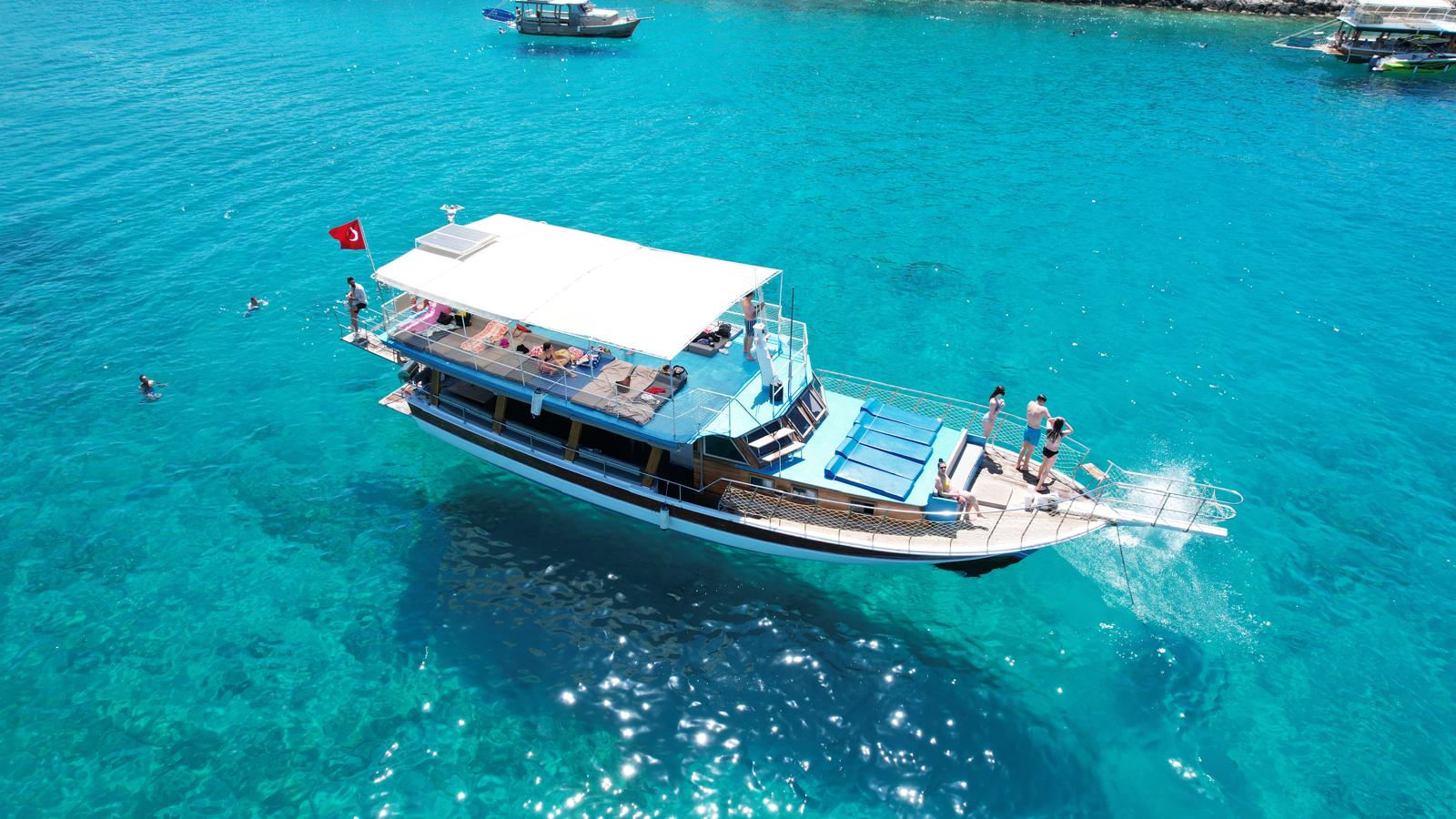 a ship on a almost transparant blue sea.